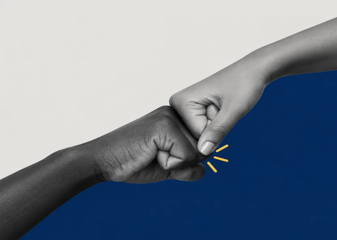 Two fists bumping in partnership